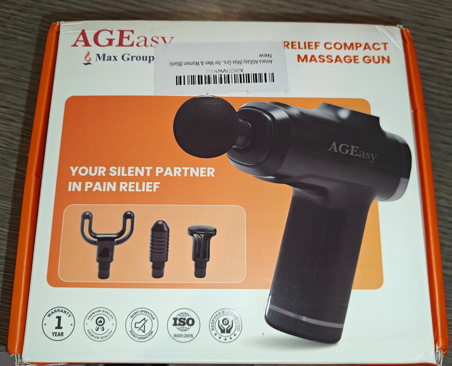 AGEasy compact massage gun used as a penile vibratory stimulator for ejaculation, front of box