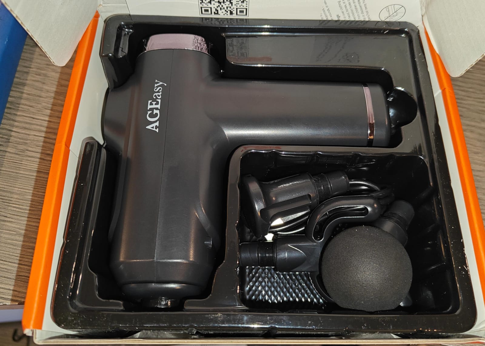 AGEasy medical vibrator unboxed showing device body and interchangeable massage heads
